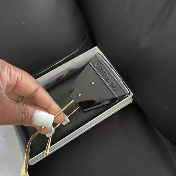 Gently used authentic Dior sunglasses with leather case.